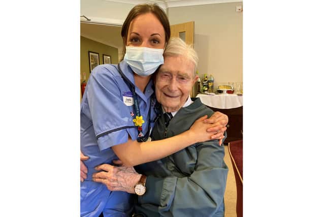 Tom Hyom on his 100th birthday with care assistant Layla Burnett.