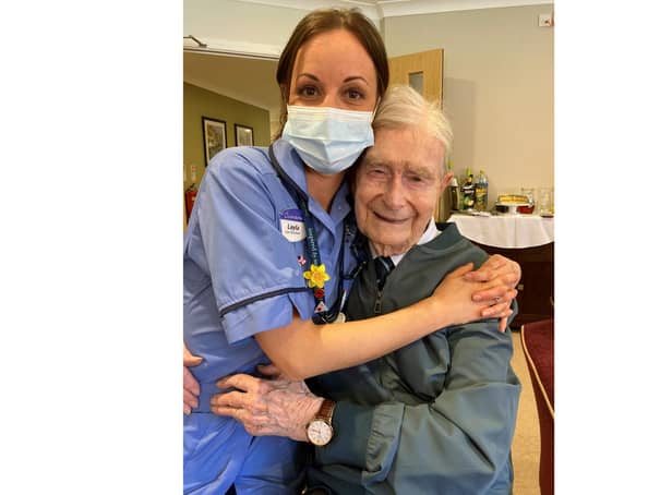 Tom Hyom on his 100th birthday with care assistant Layla Burnett.