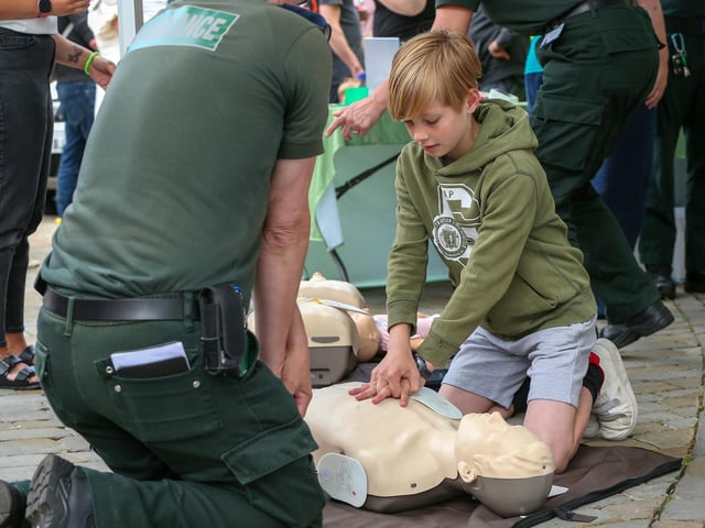 Harrison Key, 10, brushes up on his CPR at Fareham 999 Day.Picture: Chris  Moorhouse (220624-12)