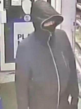 A CCTV image of the man police want to speak to over a robbery at Premier convenience store in Victoria Road North, Southsea, on Sunday January 31