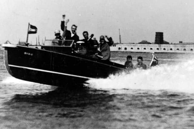 The thrill of a lifetime off Clarence Pier, Southsea, in the 1950s. In a speedbpat at 40mph. Picture: Robert James.