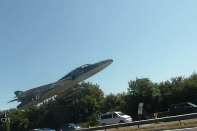 Undated handout file videograb issued by Sussex Police and the Crown Prosecution Office of the moment prior to the aircrash during the Shoreham Airshow on August 22 2015 where Pilot Andrew Hill was performing a stunt in a 1950s Hawker Hunter before it plummeted onto the A27 in West Sussex and exploded into a fireball killing 11 men Picture: Sussex Police/CPS/PA Wire