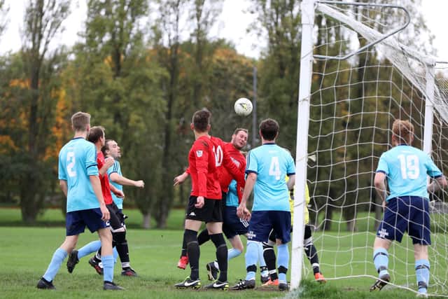 Portchester Rovers defend at a corner against Wymering. Picture: Chris Moorhouse