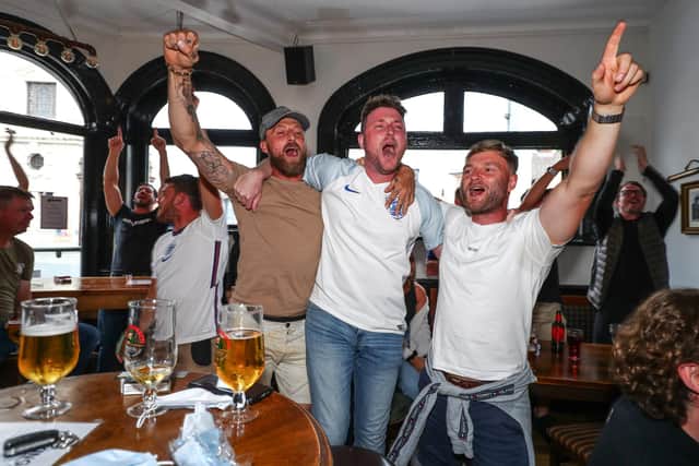 England fans watch England beat Germany 2-0 in the Euros 2020.
Fans pictured in The Kings pub celebrating on the final whistle.
Picture: Stuart Martin (220421-7042)