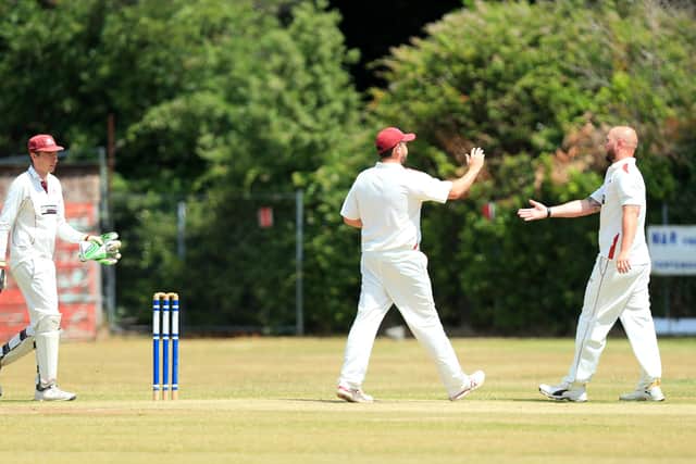 Portsmouth & Southsea's Jono Willey, right, celebrates a wicket against Havant 2nds.
Picture: Chris Moorhouse
