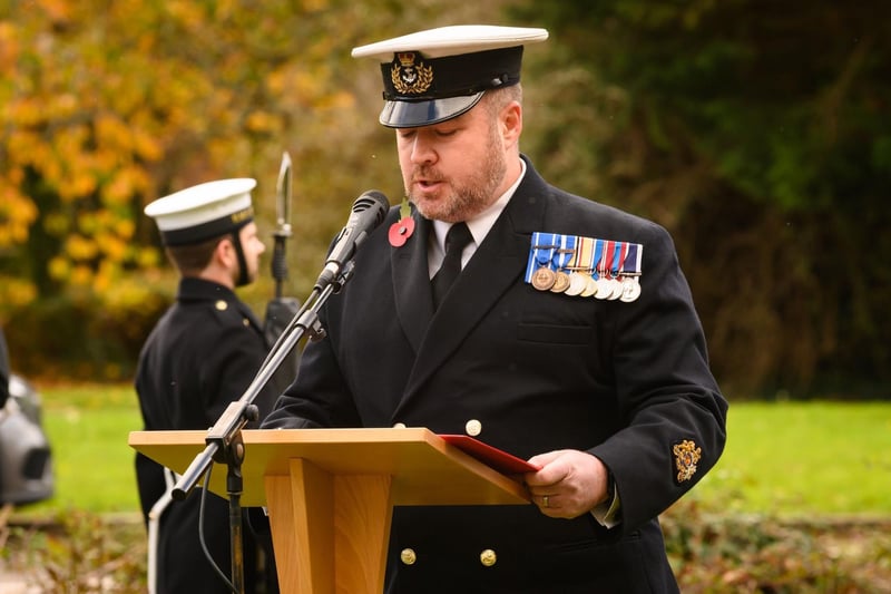 WO1 Mark Gower reading the names of the fallen.