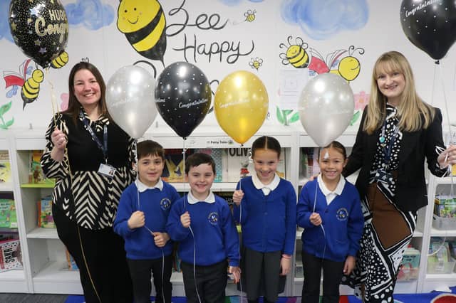Executive Headteacher Sara Paine (left) and Head of School Rachel Thripp (right) celebrate with pupils.