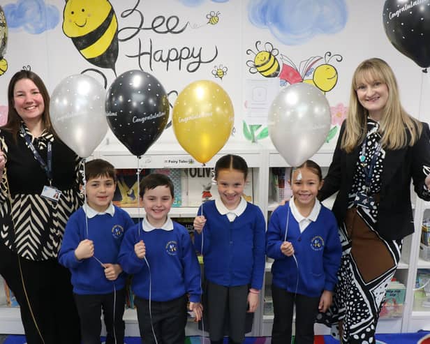 Executive Headteacher Sara Paine (left) and Head of School Rachel Thripp (right) celebrate with pupils.