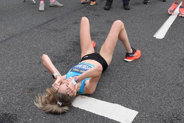 Scottish athlete Eilish McColgan collapses after setting a new course record as she romped to her third consecutive victory at the contest in 50 minutes and 43 seconds. 
Picture: Keith Woodland (171021-0)