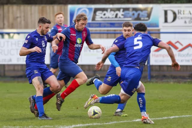 Simon Woods, second left, netted twice in US Portsmouth's first Wessex League win since January.
