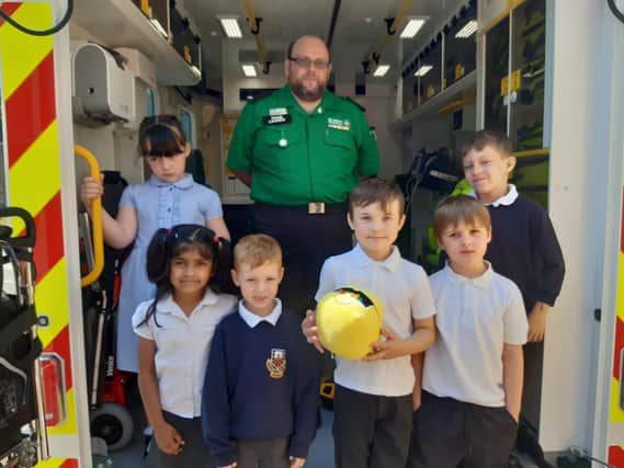 Children from Morelands Primary School learn about the work of the ambulance service