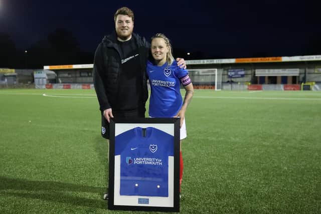 Departing Katie James, right, was presented with a signed Pompey shirt by manager Jay Sadler. Picture: Dave Haines