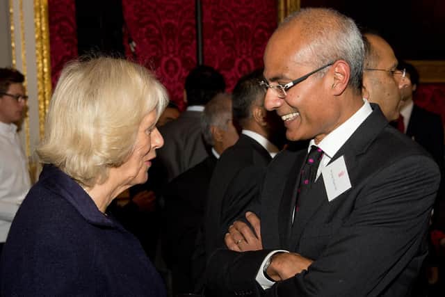 Goerge Alagiah speaking to the Duchess of Cornwall in 2013. Picture: Leon Neal/PA Wire