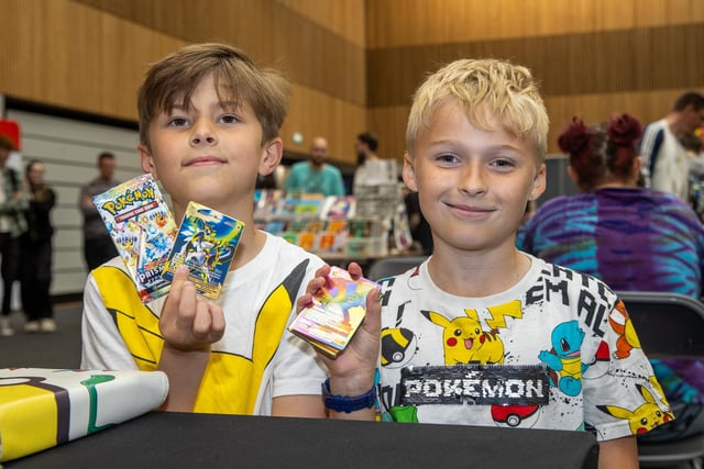 Charles, 9, and Harrison, 9, collecting Pokémon cards.  Photos by Alex Shute
