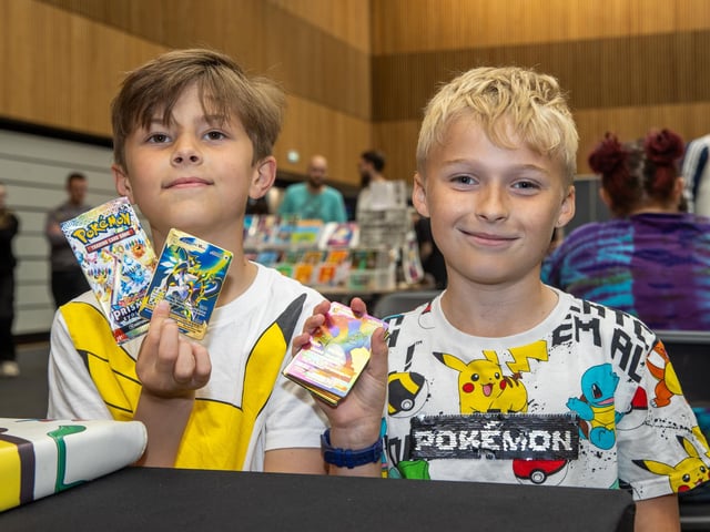 Charles, 9, and Harrison, 9, collecting Pokémon cards. Photos by Alex Shute