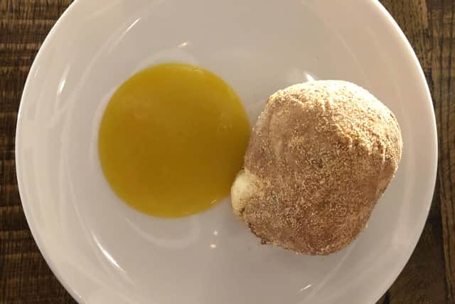 The pulled pork doughnut at the Still and West