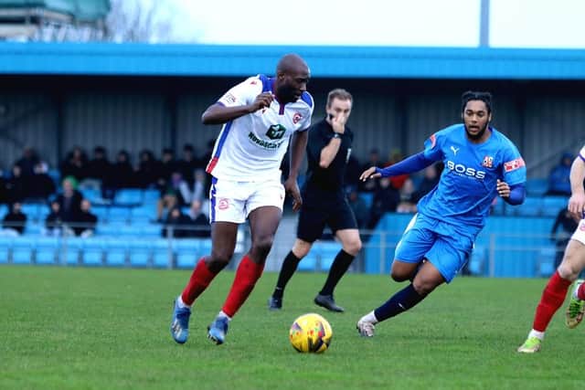 Gosport's Bedsente Gomis, left, in  action during the loss to Hartley Wintney. Picture: Tom Phillips.