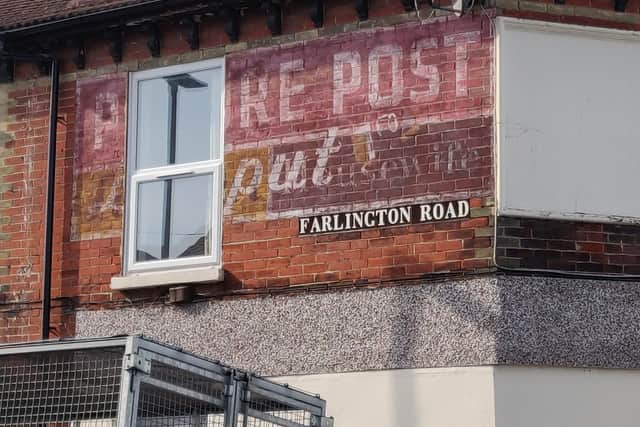 An example of a ghost advert - a faded sign in Farlington Road. Picture: Tim Sheerman-Chase
