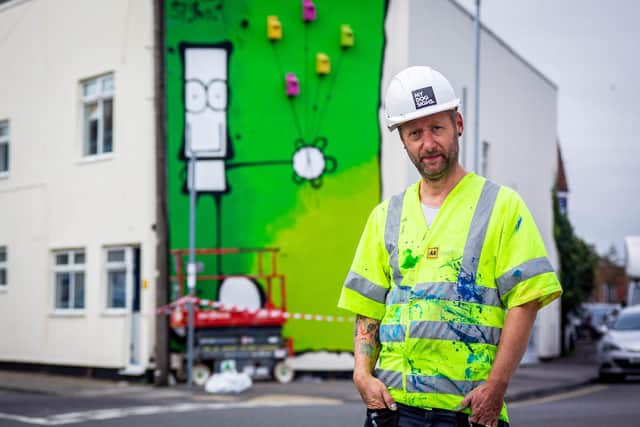 Artist MyDogSighs, painting a new mural on the Portsmouth Carers building on Francis Avenue, Portsmouth on behalf of Wilder Portsmouth in September. Picture: Habibur Rahman