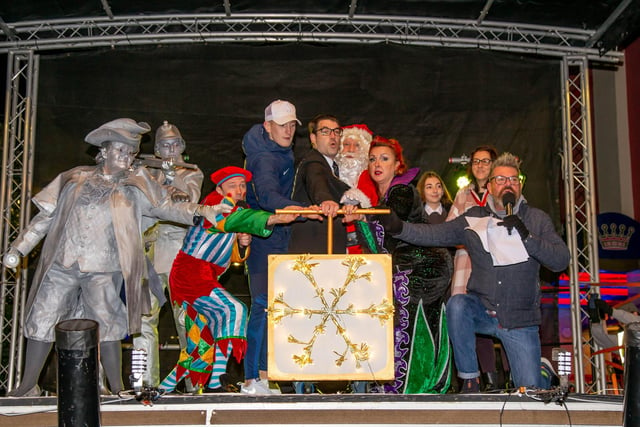 New Theatre Royal Panto Cast, deputy Lord Mayor Tom Coles and Pompey winger Ronan Curtis switching the Christmas lights on