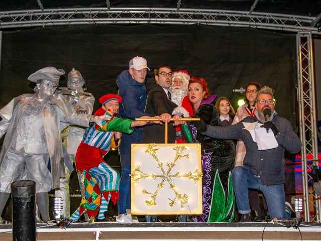 New Theatre Royal Panto Cast, deputy Lord Mayor Tom Coles and Pompey winger Ronan Curtis switching the Christmas lights on