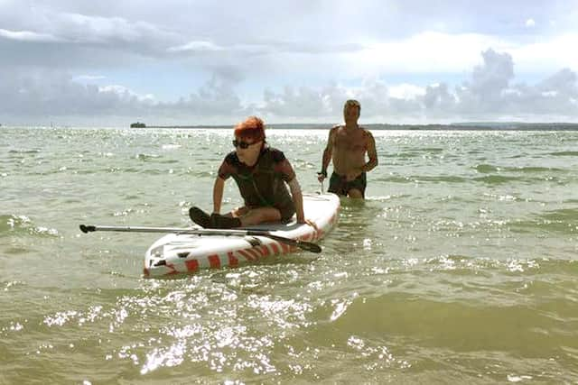 Laura Collinson from Eastney was able to go in the sea at Southsea for the first time in 25 years after the Accessible Beach Campaign For Pompey cleared away some shingle. Picture: Jonathan Schofield