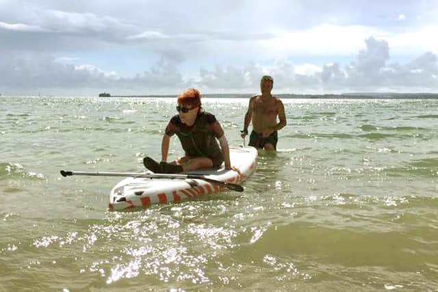 Laura Collinson from Eastney was able to go in the sea at Southsea for the first time in 25 years after the Accessible Beach Campaign For Pompey cleared away some shingle. Picture: Jonathan Schofield