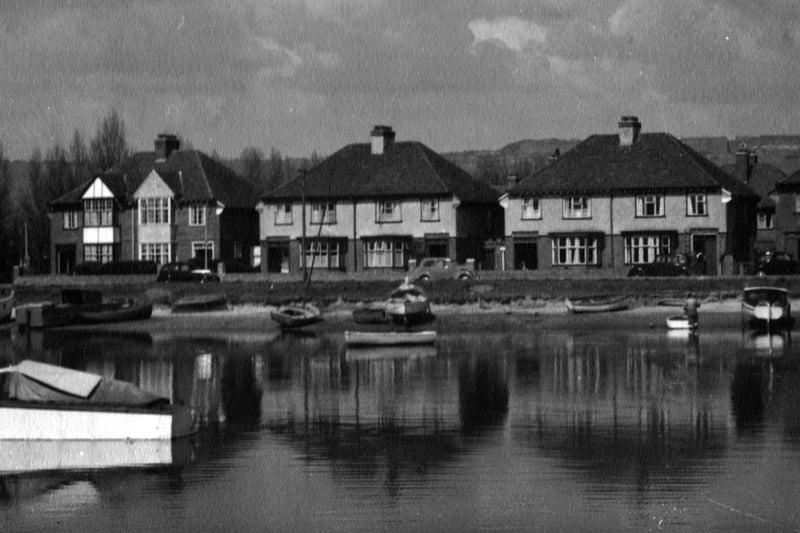 Houses in Tudor Crescent, Highbury Estate, Cosham. Where the water flowed freely between Portsea Island and the mainland and boats swayed in the tide. The M27 motorway is now there in front of these houses.