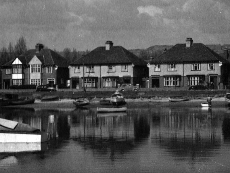 Houses in Tudor Crescent, Highbury Estate, Cosham. Where the water flowed freely between Portsea Island and the mainland and boats swayed in the tide. The M27 motorway is now there in front of these houses.