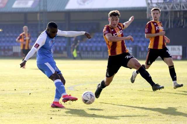 Tonbridge Angels (blue) - seen here in FA Cup action against Bradford City at their Longmead Stadium ground last November - have told the National League they will be insolvent by the end of this month. Photo by Henry Browne/Getty Images.