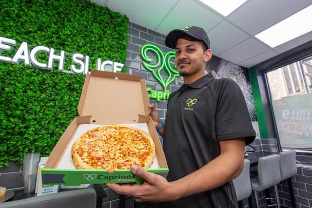Caprinos Pizza, Havant officially opens its doors on Wednesday, April 13 2022.Pictured: Uzair Mahomedy with a freshly made pizzaPicture: Habibur Rahman