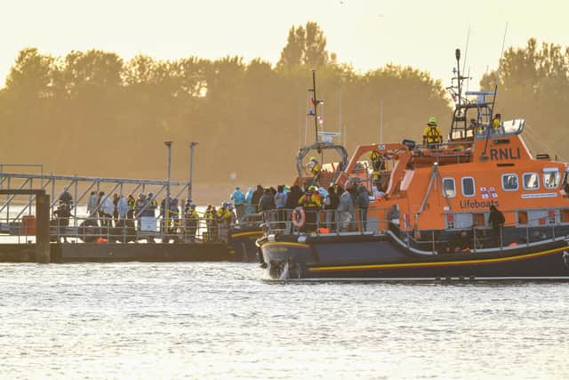 Around 140 migrants arrive in Portsmouth, Hampshire on Sunday after being transferred from a single dingy south of the Isle of Wight in the English Channel