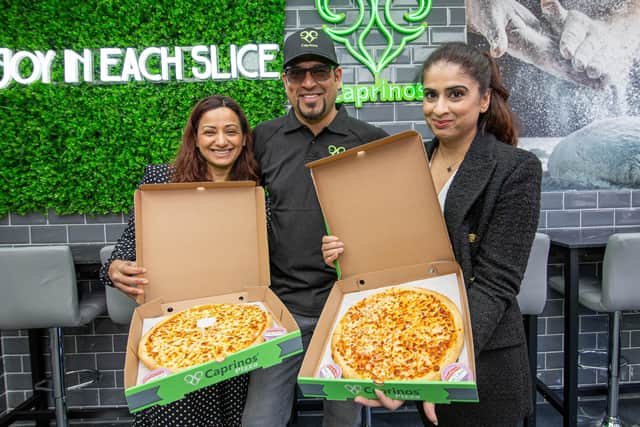 Caprinos Pizza, Havant officially opens its doors on Wednesday, April 13 2022.Pictured: Operational manager, Haleema Asmal, with her husband, general manager, Ismail Asmal and franchise owner, Sadaf MalikPicture: Habibur Rahman