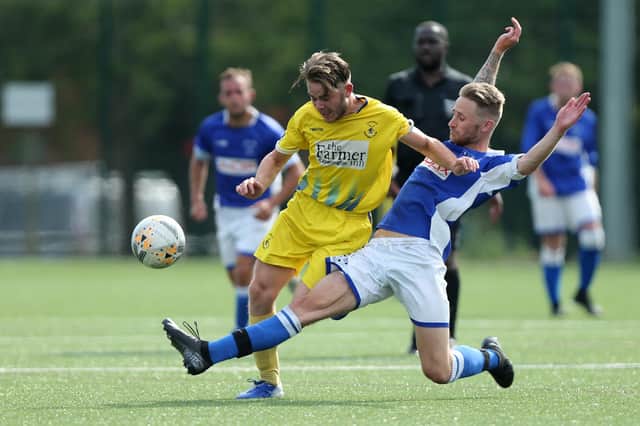 Lewis Crook, right, in action for Denmead in a pre-season friendly with Clanfield last August.