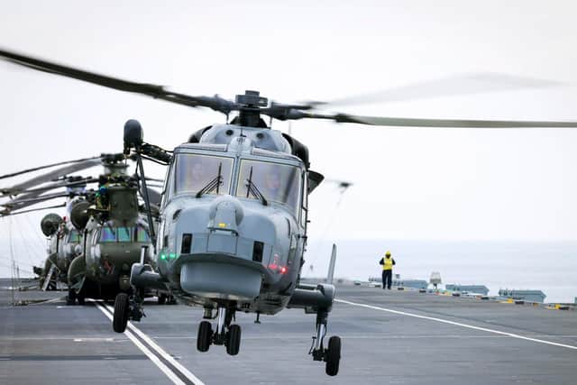 A Wildcat Helicopter of 825 Naval Air Squadron (Yeovilton) lands on the deck of HMS Prince of Wales.
