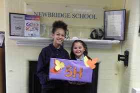 Year 5 pupils Kannie Bah (left) and Poppy Warner from Newbridge Junior School in Fratton with a box of donations for With Thankful Hearts