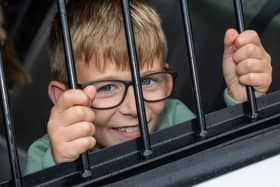 Caleb, 8, found himself behind bars at the Port Solent 999 Day.  Photos by Alex Shute