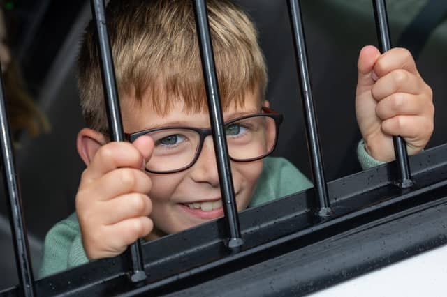 Caleb, 8, found himself behind bars at the Port Solent 999 Day. Photos by Alex Shute