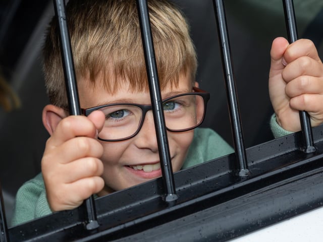 Caleb, 8, found himself behind bars at the Port Solent 999 Day.  Photos by Alex Shute