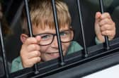 Caleb, 8, found himself behind bars at the Port Solent 999 Day.  Photos by Alex Shute