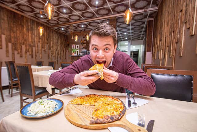 Reporter Joe Buncle eating the Portsmouth Special at Napoli Pizza and Pasta in North End
Picture: Habibur Rahman