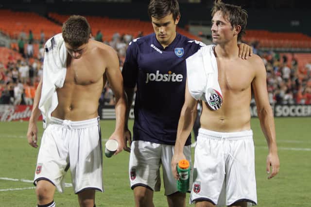 Marlon Pack leaves the pitch alongside Joel Ward (left) and Tommy Smith (right) following a Pompey pre-season defeat at DC United in July 2010. Picture: Joe Pepler