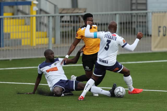 Moussa Diarra seems to have won the ball from Justin Amaluzor, but ref Steven Hughes awarded Maidstone a penalty for this challenge. Picture by Dave Haines.