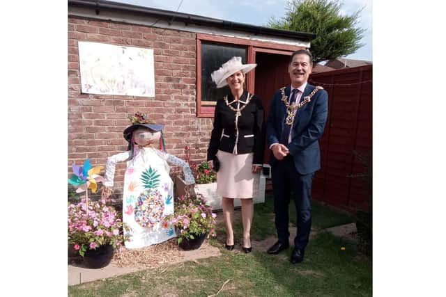 Lord Mayor of Portsmouth Rob Wood and Lady Mayoress Debra Wood with the winning entry by Pineapple Tots Childcare with Camilla Crow