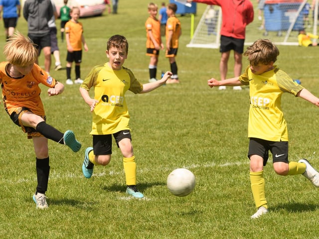 Action from the Clanfield youth football tournament at Horndean Technology College. Picture: Keith Woodland (270521-862)