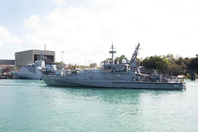 HMAS Wollongong departs from HMAS Coonawarra in Darwin, NT, as HMS Spey of the Royal Navy (background) prepares by to follow.