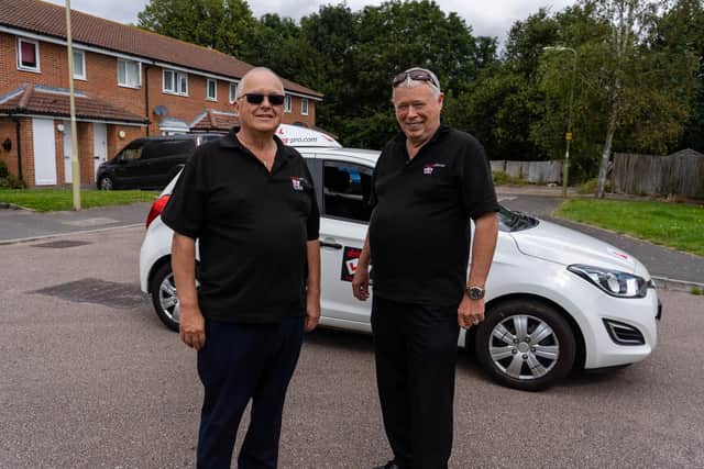 Driving instructor Glen Robbins and Liam Greaney, founder of Driving Pro, in front of an instructor's car. Picture: Matthew Clark