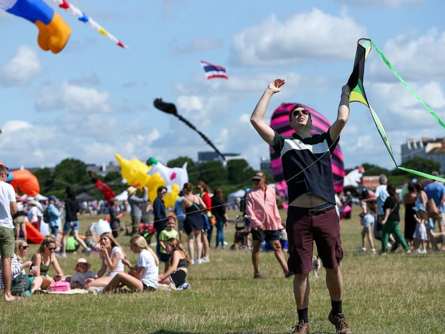 Chris Havard launches his son's kite at the Portsmouth International Kite Festival, Southsea Common.Picture: Chris  Moorhouse (270724-23)
