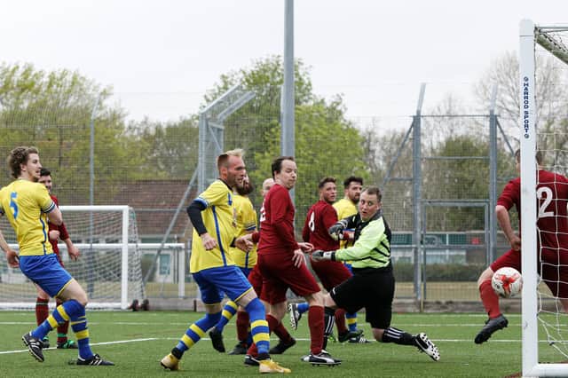 Meon Milton go close to a winner against FC Strawberry (maroon) at Cowplain School. Picture: Chris Moorhouse