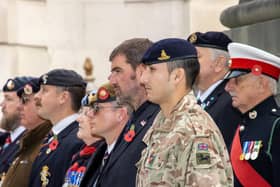 Veterans and serving military personnel taking part in the Remembrance service held in Portsmouth Guildhall on Thursday morning. Photos by Alex Shute